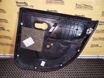 Обшивка двери задней левой (дверная карта) 93H76Z Nissan Note купить