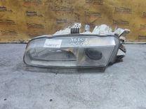 Фара левая FO8V24 Mazda Xedos 6 - Фото 1