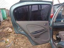 Обшивка двери задней левой (дверная карта) 5DAA1E