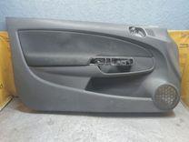 Обшивка двери передней левой (дверная карта) HK41DF Opel Corsa - Фото 1