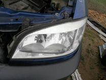 Ус под фару левый GKO1F5 Opel Zafira