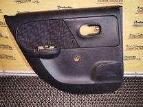 Обшивка двери задней левой (дверная карта) 93H76Z Nissan Note