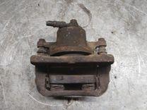 Суппорт передний левый KQJ98A Toyota Yaris купить в магазине запчастей бу