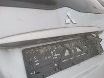 Накладка подсветки номера L8DNAZ Mitsubishi Grandis