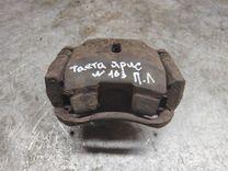 Суппорт передний левый KQJ98A Toyota Yaris - Фото 1