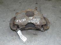 Суппорт передний левый JX25YL Mazda 323F - Фото 1